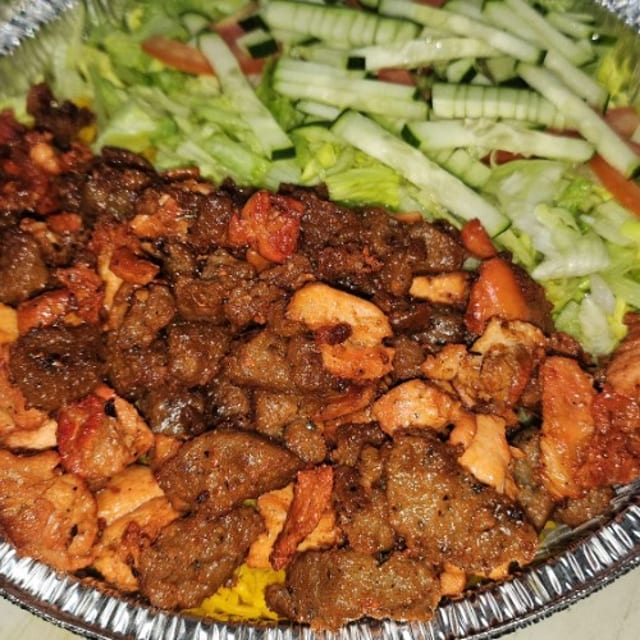 Mixed Lamb and Chicken Over Salad.