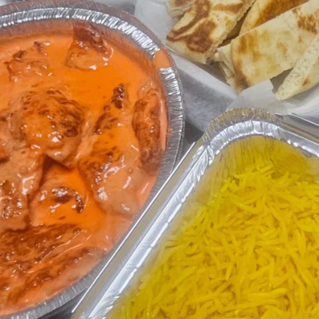 Buttered Shrimp with Seasoned Yellow Rice & Pita.