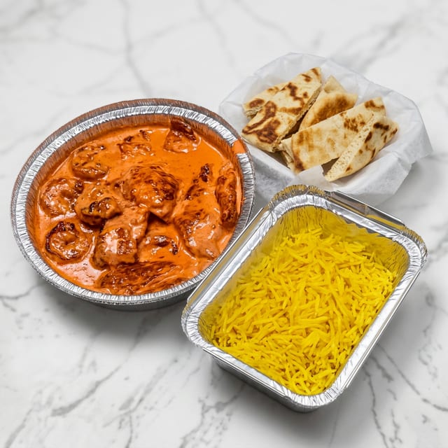 Butter Shrimp with Seasoned Yellow Rice & Pita.